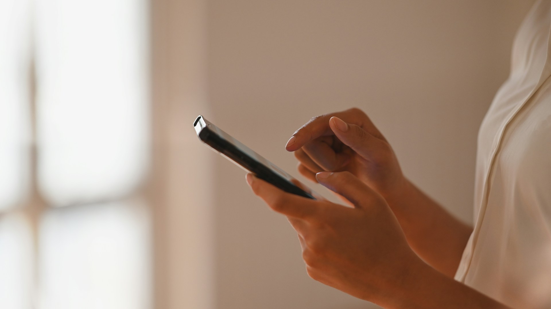 a woman holding a phone
